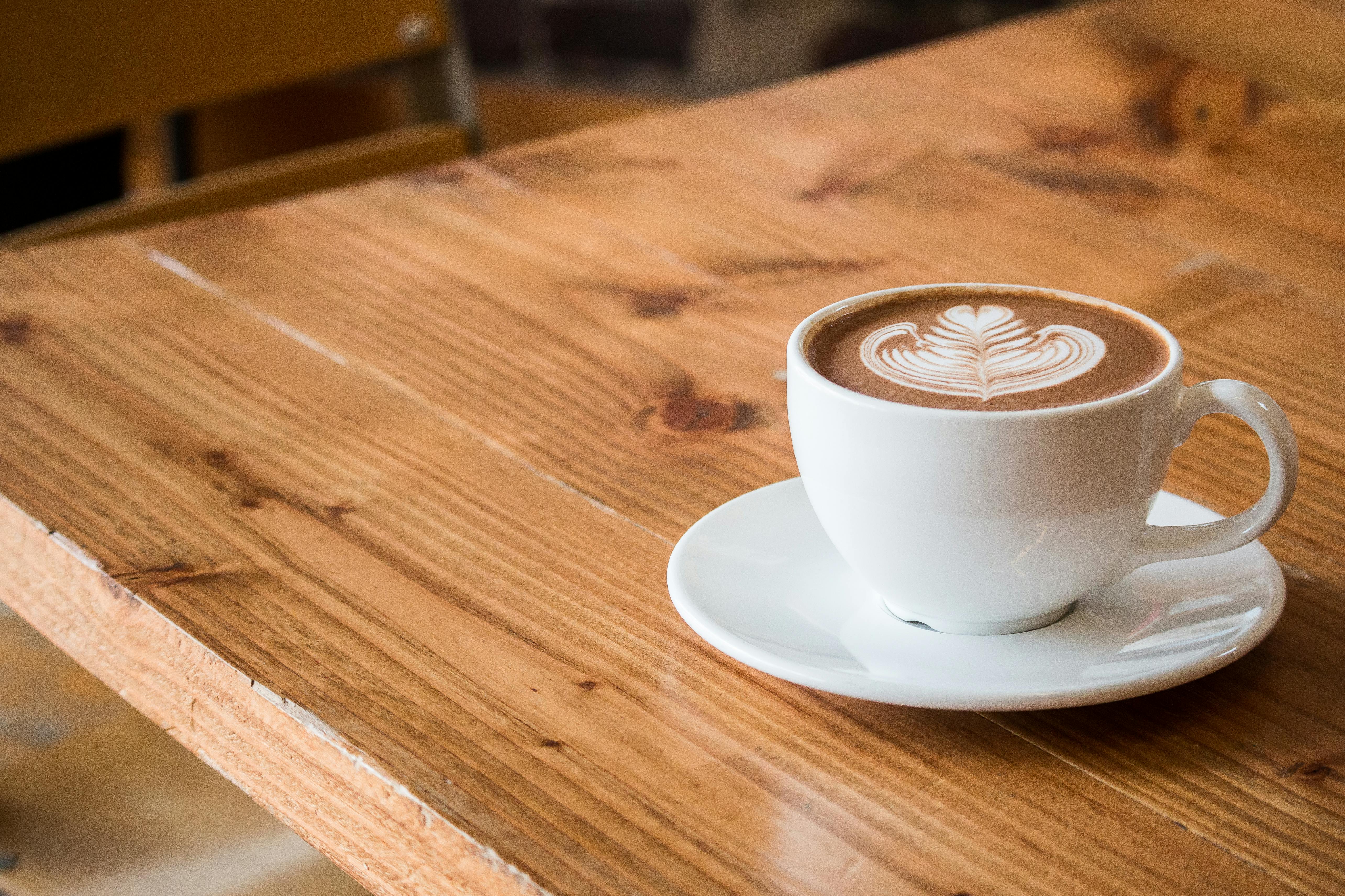 A cozy cafe counter with warm coffee-shop lighting
