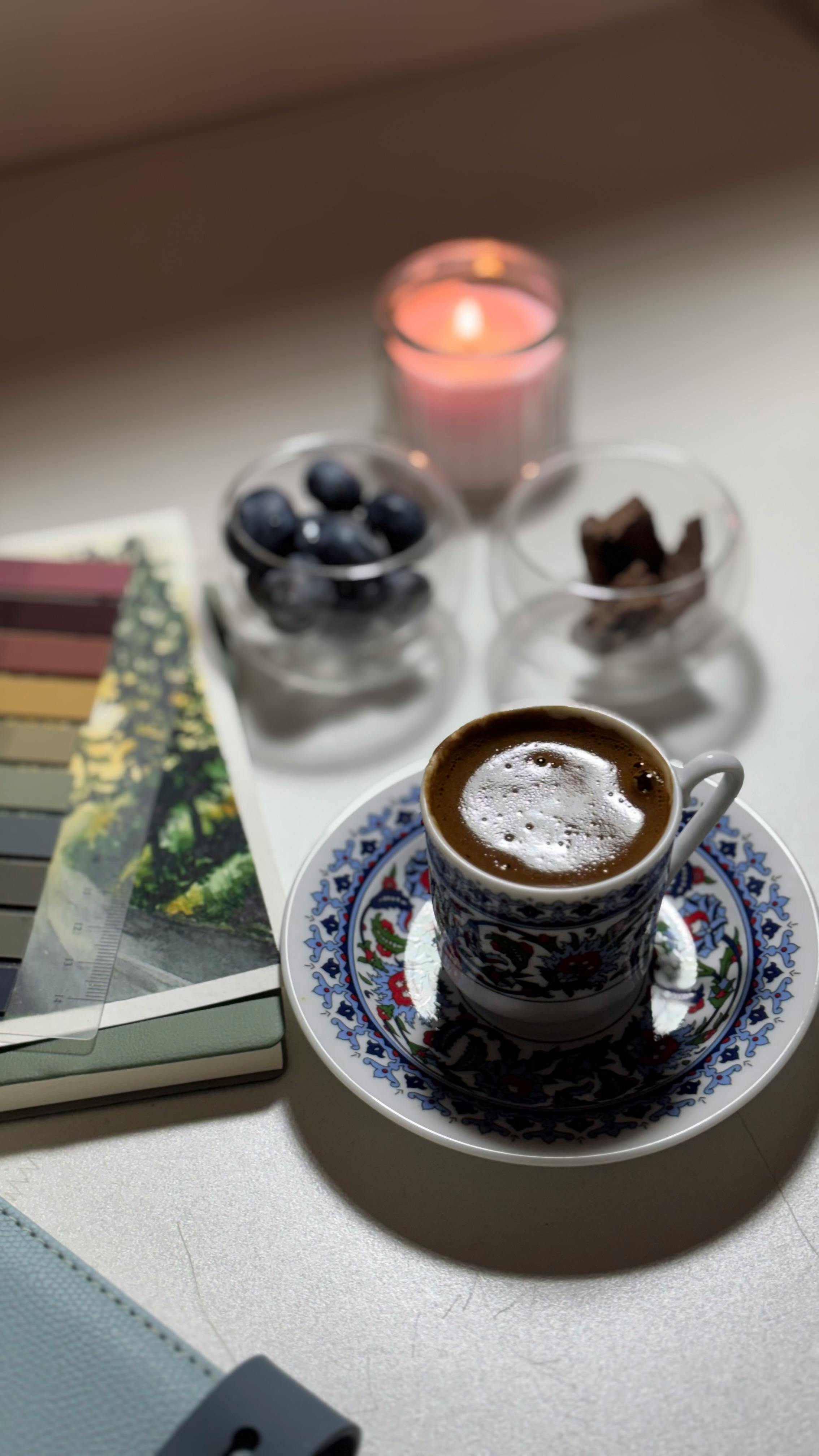 Barista pouring a carefully made coffee drink